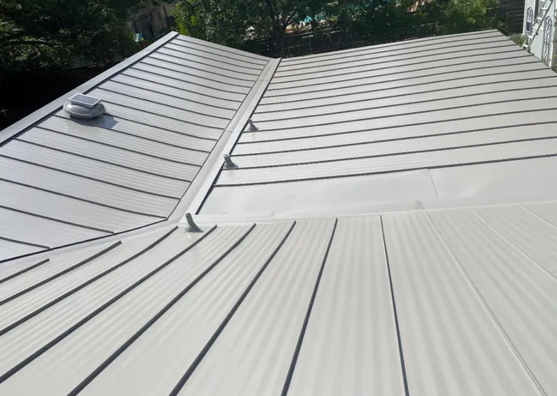 Solar attic fan installed on a metal roof for Roof Ventilation in Altamonte Springs